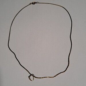 gold tone necklace with heart